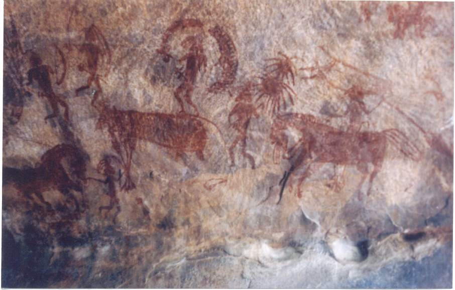 An image of a cave painting, an early example of art made from soil, in which cave people appear to be herding or hunting large mammals, possibly horses or cows.
