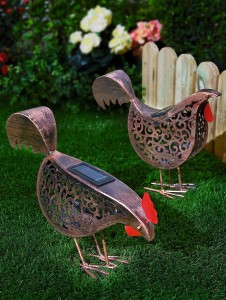 Two solar powered hen structures for garden lighting